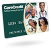 CareCredit credit card with green background, photo collage of patients and provider, partial number “1234 567”, “PRE-APPROVED” text